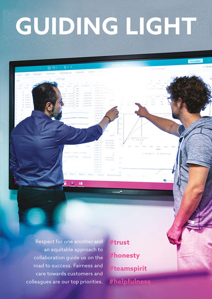 Two experts standing in front of the electronic whiteboard