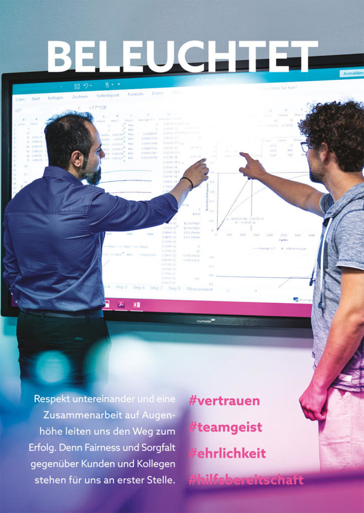 Two experts standing in front of the electronic whiteboard